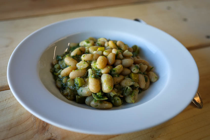 Rancho Gordo cooked Marcella beans with leeks, thyme, and parsley. 