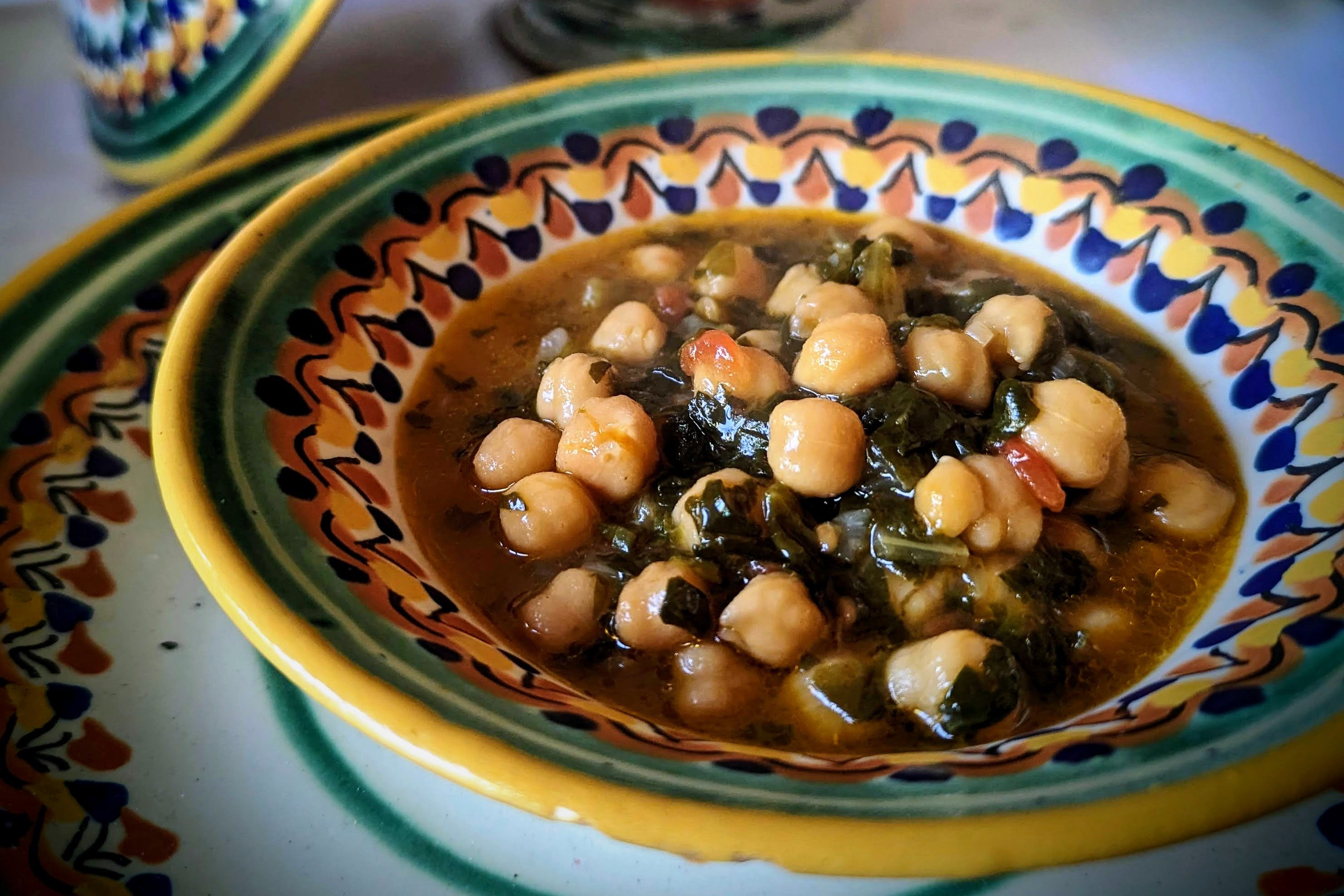 Garbanzo and spinach stew in a colorful bowl
