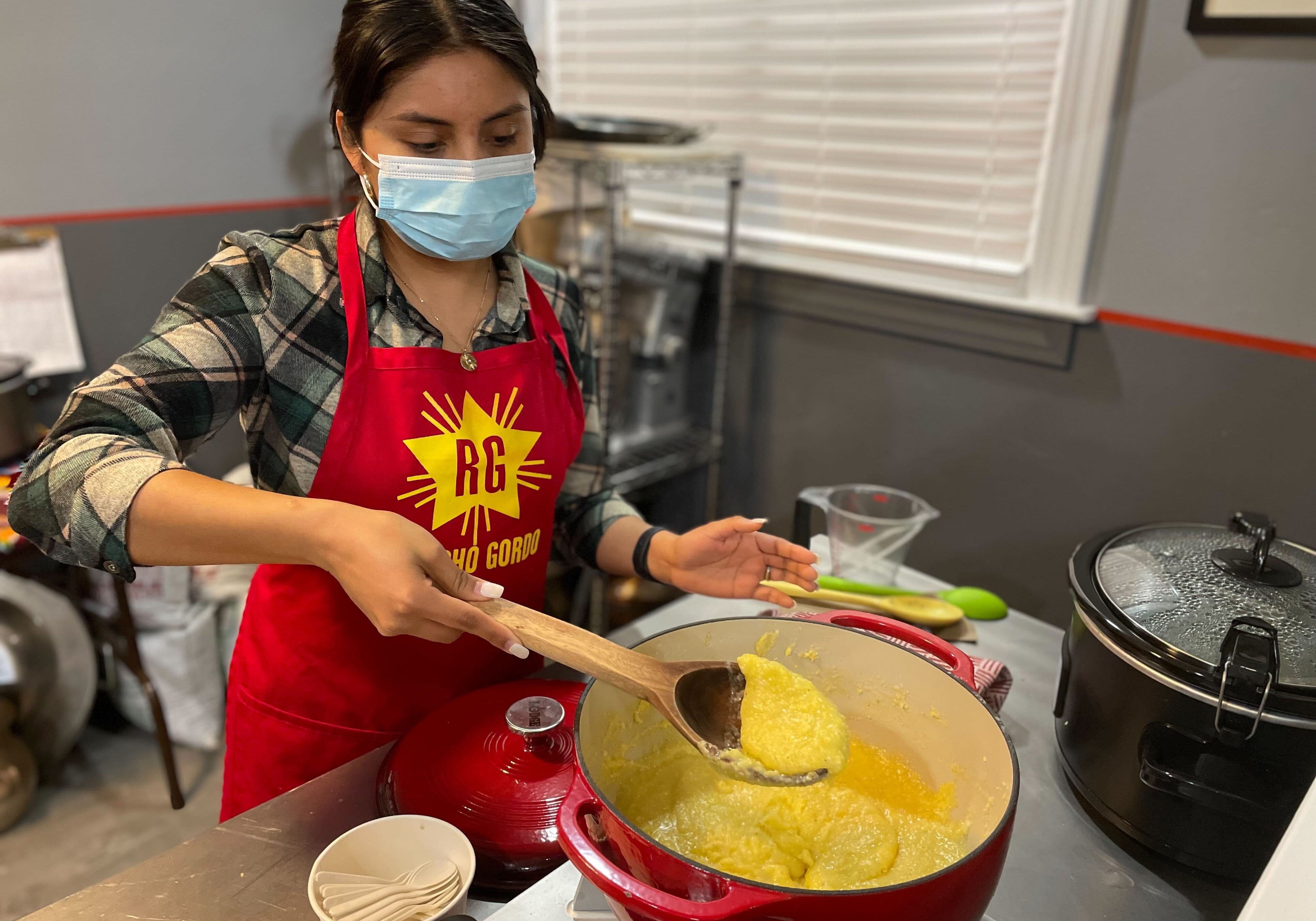 Rancho Gordo female employee cooking yellow polenta 