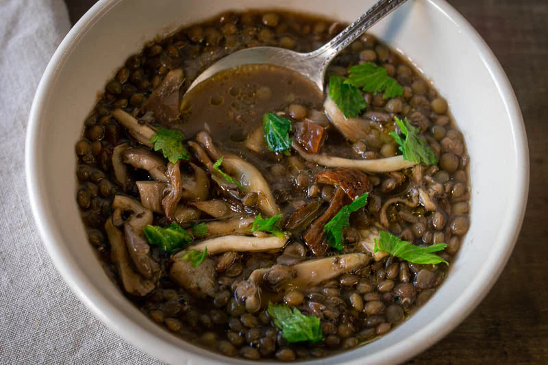 Rancho Gordo cooked lentils with dried porcini mushrooms and celery stalk