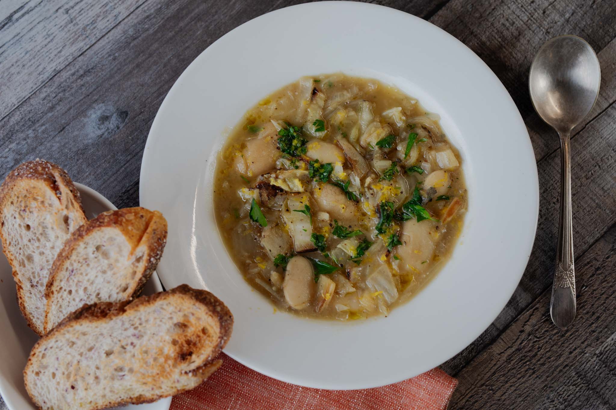 Charred Cabbage and Caramelized Shallot Soup with Royal Corona Beans and Bread