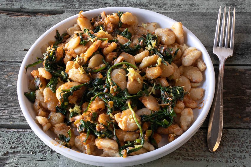 Golden Pan-Fried Big White Beans with Wilted Greens - Rancho Gordo