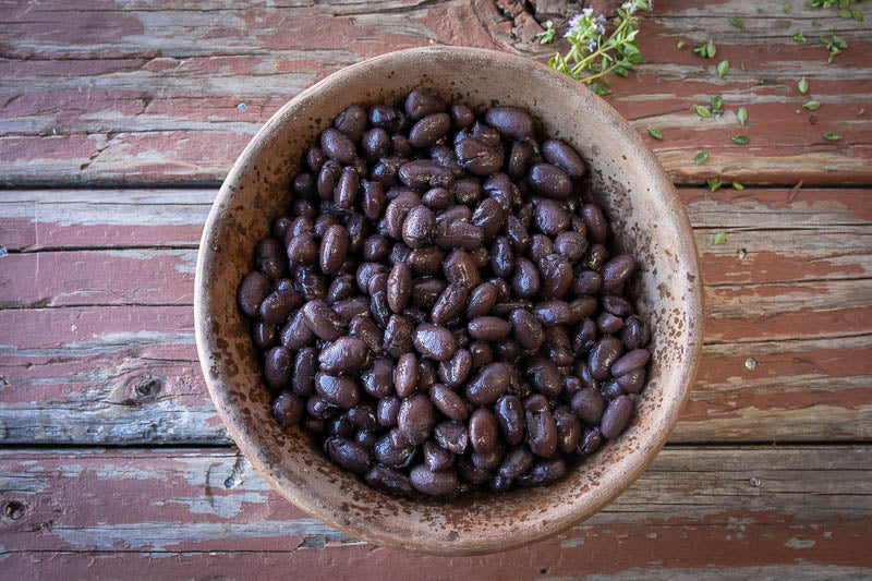 A bowl of cooked Rancho Gordo Midnight black beans 