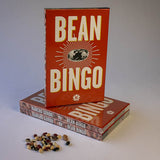 Three of Rancho Gordo Bean Bingo in the side there's a pile of dry beans 