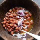 Rancho Gordo cooked King City Pink bean topped with olive oil and onions 