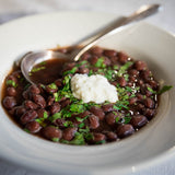 Rancho Gordo cooked Hidatsa Red Bean with herbs and cottage cheese.
