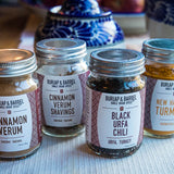 Four different Burlap and Barrel Spices: Cinnamon Verum, Cinnamon Verum Shavings, Black Urfa Chili, New Harvest Turmeric. 