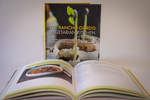 The Rancho Gordo Vegetarian Kitchen, Volume 2 with an open book in the bottom.