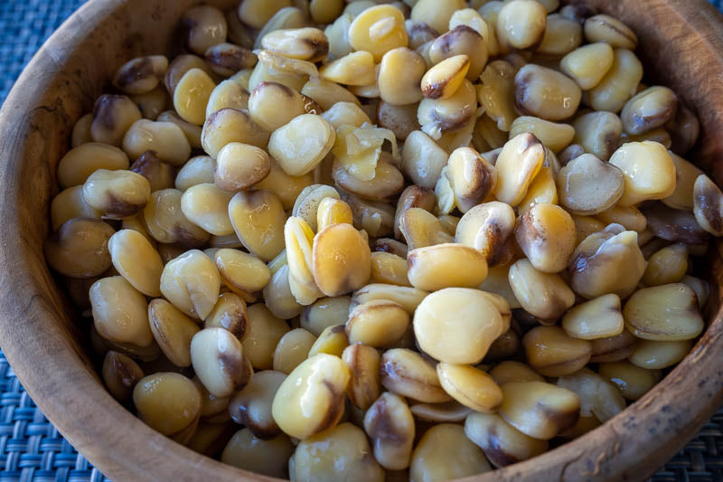 Cooked cicerchie beans in a wooden bowl