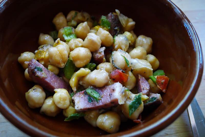 Cooked Garbanzo bean with tasso ham, celery, and  thyme