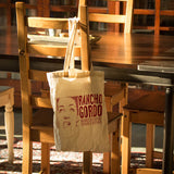 Rancho Gordo tote bag hanging from a chair in a dining table 