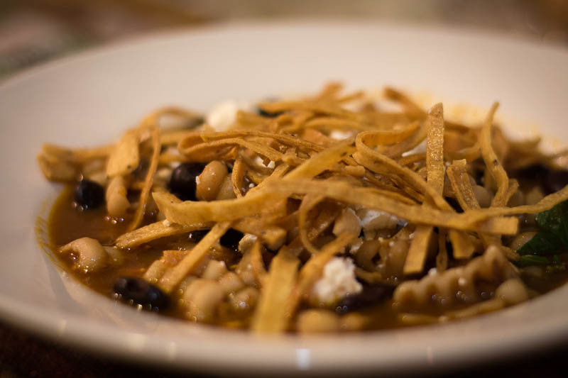 Ayocote Negro soup topped with fried tortilla strips-Rancho Gordo, Heirloom beans.