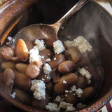 Rancho Gordo cooked Snowcap bean topped with queso fresco cojita